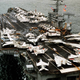 The crowded flight deck of USS Nimitz in 1981 with numerous types of long-range aircraft on her deck.